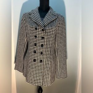 Norm Thopson, Large, Black and White Coat.